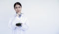 Portrait of young Asian woman scientist in white uniform working in laboratory Royalty Free Stock Photo