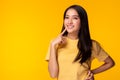 Portrait young asian woman with smile Beautiful girl wear yellow T shirt with yellow background copy space at studio Pretty asia Royalty Free Stock Photo