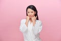 Portrait of young Asian woman smiling friendly with hands on chin Royalty Free Stock Photo