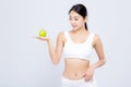 Portrait young asian woman smiling holding green apple and beautiful body diet with fit isolated Royalty Free Stock Photo