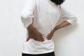 Young asian woman suffering low back pain and waist lumbar pain