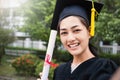 Portrait of young asian woman outside on her graduated day Royalty Free Stock Photo