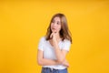 Portrait young asian woman thinking thought looking inspiration for idea working business in white t-shirt Royalty Free Stock Photo