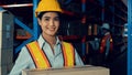 Portrait of young Asian woman warehouse worker smiling in the storehouse Royalty Free Stock Photo