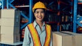 Portrait of young Asian woman warehouse worker smiling in the storehouse Royalty Free Stock Photo