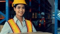 Portrait of young Asian woman warehouse worker smiling in the storehouse Royalty Free Stock Photo