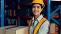 Portrait of young Asian woman warehouse worker smiling in the storehouse Royalty Free Stock Photo