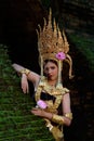 Portrait of a young Asian woman wearing an Apsara dress with ghost face makeup