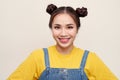 Portrait of young Asian woman wearing jeans dungaree on white background