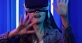 Portrait of young asian woman wearing vr for play video game.