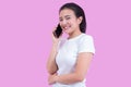 Portrait of young asian woman wearing white shirt successful talking phone call on smartphone and happy smile isolated Royalty Free Stock Photo