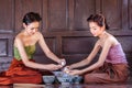 Portrait young asians women dressed in ancient Thailand are helping to make the dessert thai of Thai culture