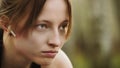 Portrait of young athlete woman in start position with earphones