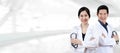 Portrait of young attractive asian doctor team or physician group crossed arm holding stethoscope medical equipment Royalty Free Stock Photo