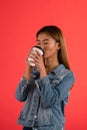 Young attractive asian girl drinking coffee in studio Royalty Free Stock Photo