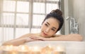 Portrait of young attractive asian girl takes a bath with candles relax in the bathroom. Royalty Free Stock Photo