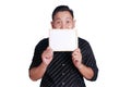 Young Asian Man Showing Small Whiteboard Covering His Face Royalty Free Stock Photo