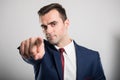 Portrait of young attractive business man pointing camera Royalty Free Stock Photo