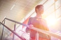 Portrait of young attractive businesswoman walking down stairs Royalty Free Stock Photo