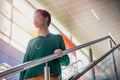 Portrait of young attractive businesswoman walking down stairs Royalty Free Stock Photo