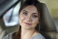 Portrait of a young attractive caucasian woman behind the wheel driving a car. Royalty Free Stock Photo