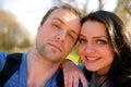 Portrait of young attractive couple having emotional fun tomfoolery together.