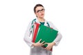 Tired young woman doctor with stethoscope holding binders in her hands in white uniform on white background Royalty Free Stock Photo