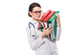 Angry young woman doctor with stethoscope holding binders in her hands in white uniform on white background Royalty Free Stock Photo