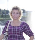 Portrait of a young attractive girl at the fountain