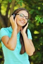 Portrait of young attractive girl listening to music with headphones Royalty Free Stock Photo