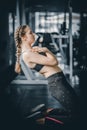 Portrait young attractive healthy woman body curve fitness doing exercises workout with ball in gym. Royalty Free Stock Photo