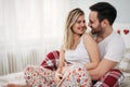 Portrait of young loving couple in bedroom Royalty Free Stock Photo
