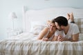 Portrait of young loving couple in bedroom Royalty Free Stock Photo