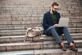 Portrait of young attractive man using laptop computer Royalty Free Stock Photo