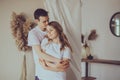 Portrait of young attractive romantic couple hugging and kissing, being loving with each other. Love and relationships lifestyle. Royalty Free Stock Photo