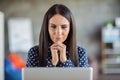 Portrait of young attractive serious focused thoughtful minded businesswoman thinking look in laptop work at office Royalty Free Stock Photo