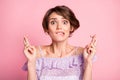 Portrait of young attractive shocked crazy frightened woman worrying about exam bite lips isolated on pink color Royalty Free Stock Photo