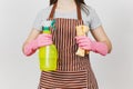 Portrait of young attractive smiling brunette caucasian housewife on white background. Beautiful housekeeper woman