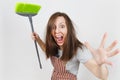 Portrait of young attractive smiling brunette caucasian housewife on white background. Beautiful housekeeper woman