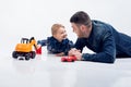 Portrait of young attractive smiling father playing with his lit Royalty Free Stock Photo