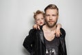 Portrait of young attractive smiling father playing with his little cute son. Fathers day Royalty Free Stock Photo