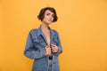 Portrait of a young attractive woman dressed in denim jacket Royalty Free Stock Photo