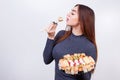 Portrait of young attractive woman eating sushi, studio shoot on Royalty Free Stock Photo