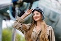 Portrait of a young attractive woman in a helmet and pilot suit Royalty Free Stock Photo