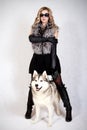 Portrait of a young attractive woman with a husky dog Royalty Free Stock Photo