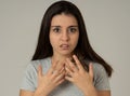 Portrait of a young attractive woman looking scared and shocked. Human expressions and emotions Royalty Free Stock Photo