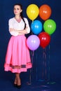 Portrait of a young attractive woman near many bright balloons Royalty Free Stock Photo