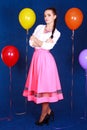 Portrait of a young attractive woman near many bright balloons Royalty Free Stock Photo