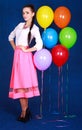 Portrait of a young attractive woman near many bright balloons Royalty Free Stock Photo