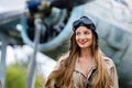 Portrait of a young attractive woman pilot in a helmet and pilot suit Royalty Free Stock Photo